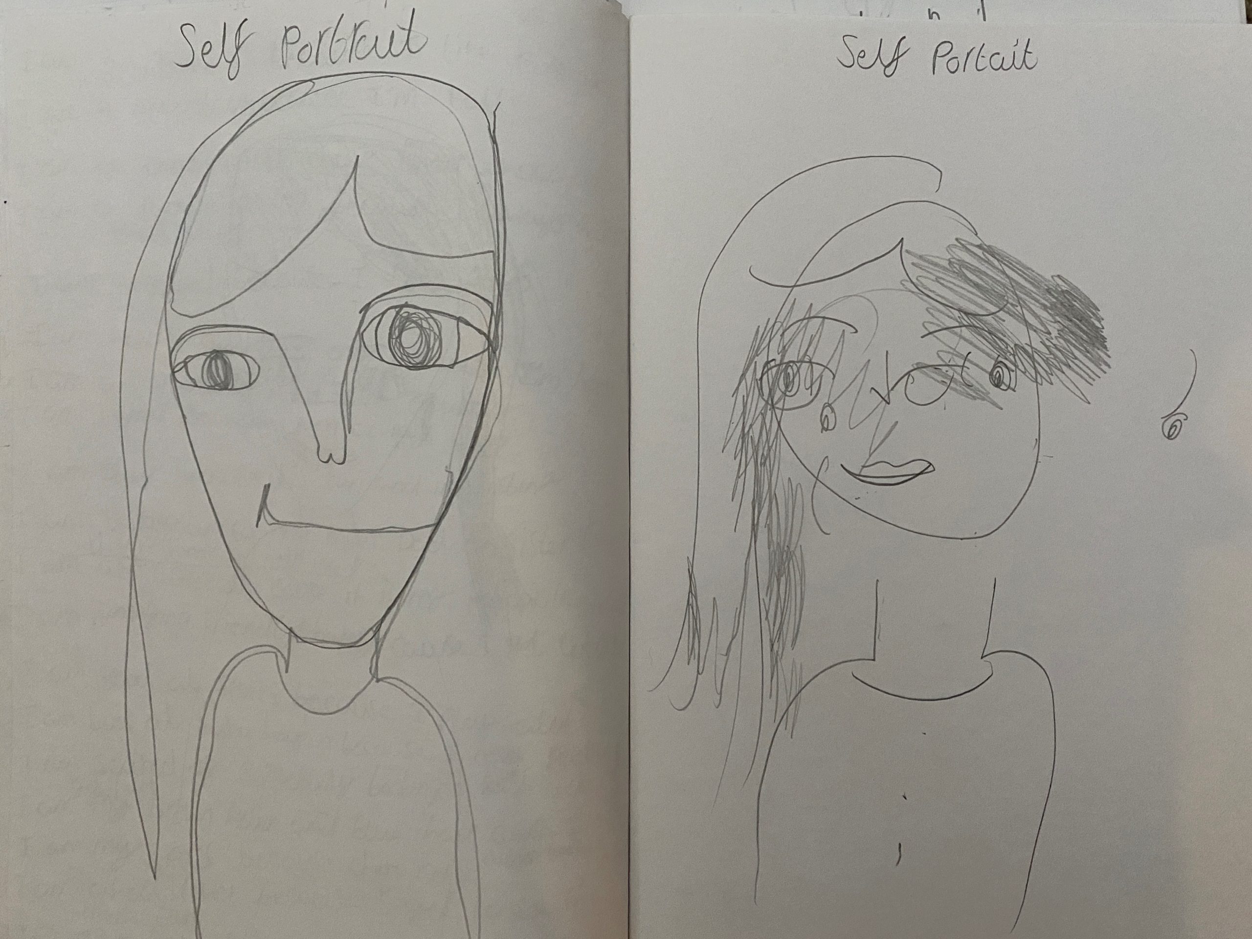 Two self-portraits, one drawn without looking